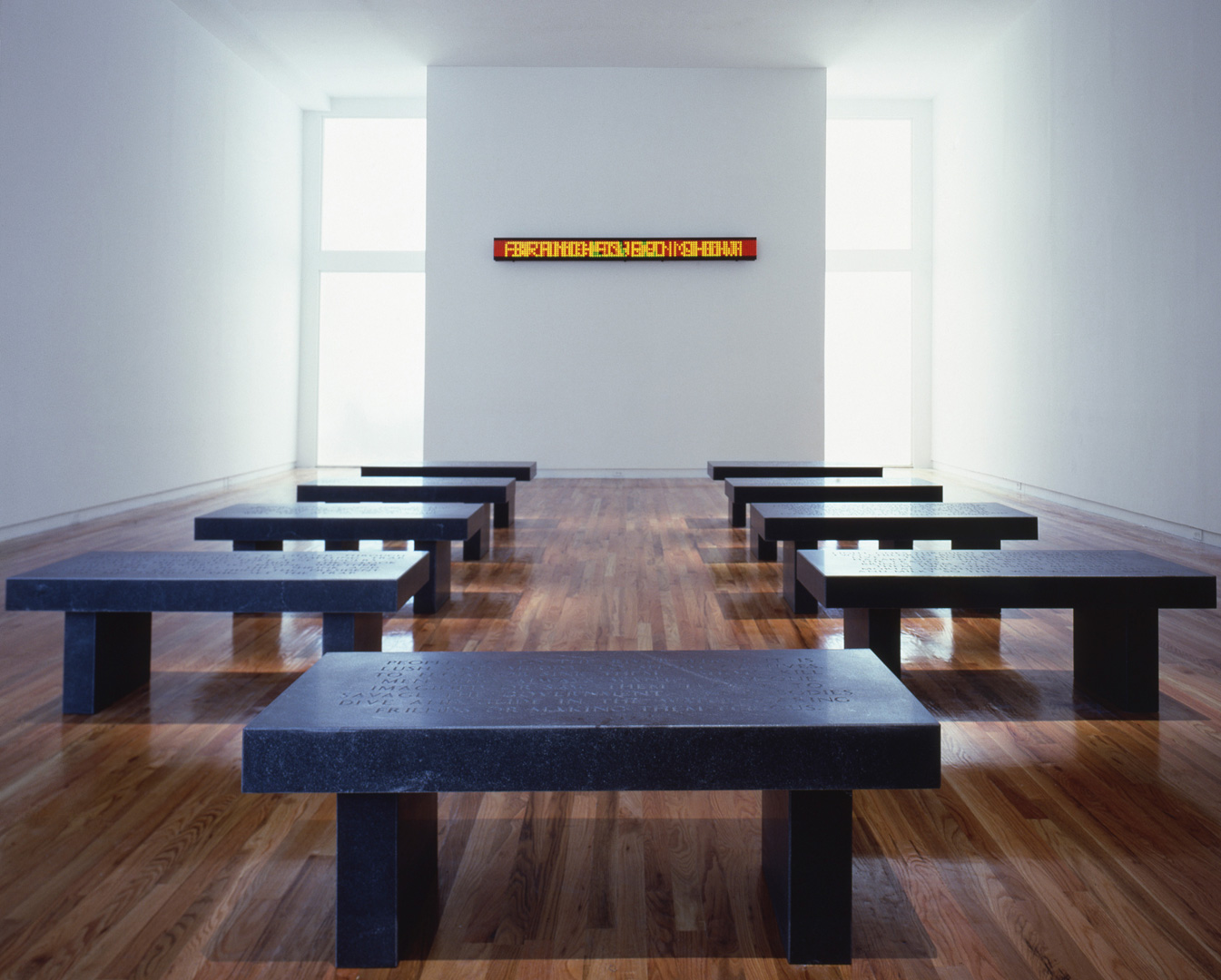 Jenny Holzer - Under a Rock, 1986, ten black granite benches with three LED signs